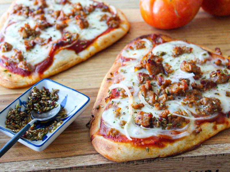 Naan Pizza with Italian Sausage, Toasted Fennel, & Onions - Rumi Spice